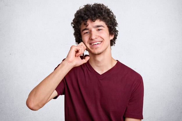 Close up portrait of young man with curly hair