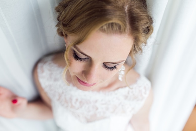 Close-up of pretty bride thinking