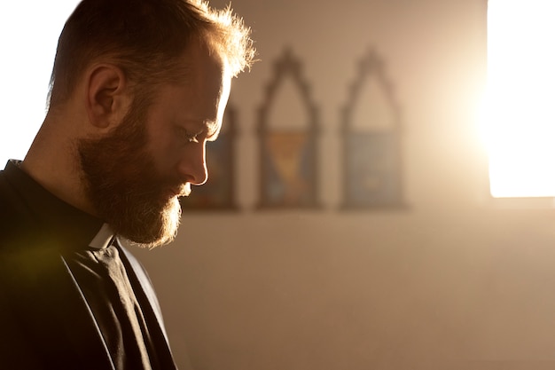 Close up on priest praying