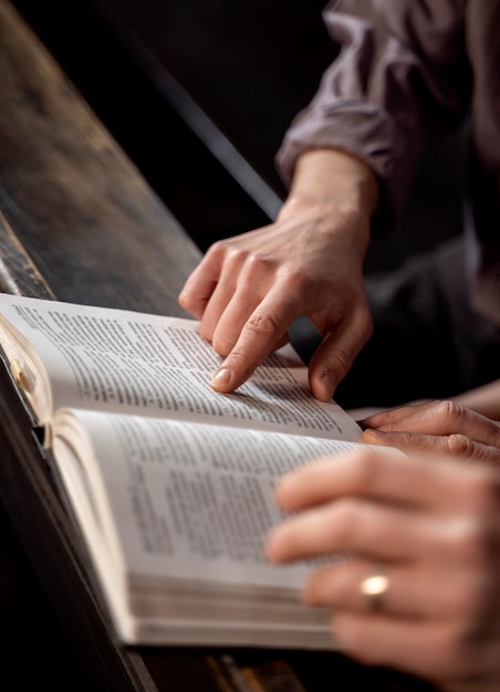 Close up on priest reading form the bible