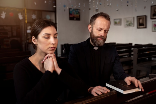 Close up on priest reading form the bible