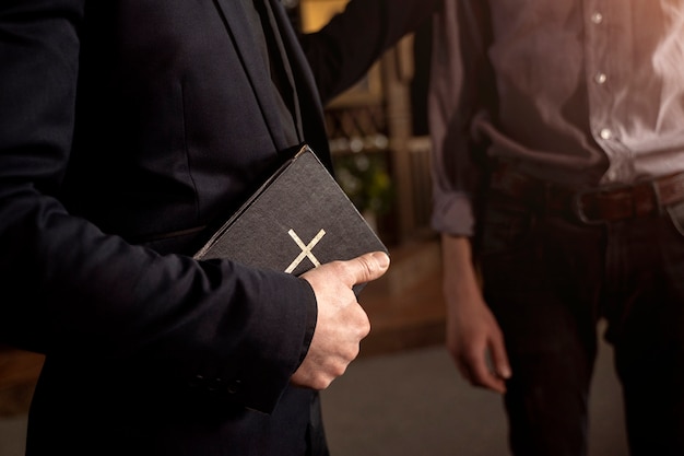 Free Photo close up on priest reading form the bible