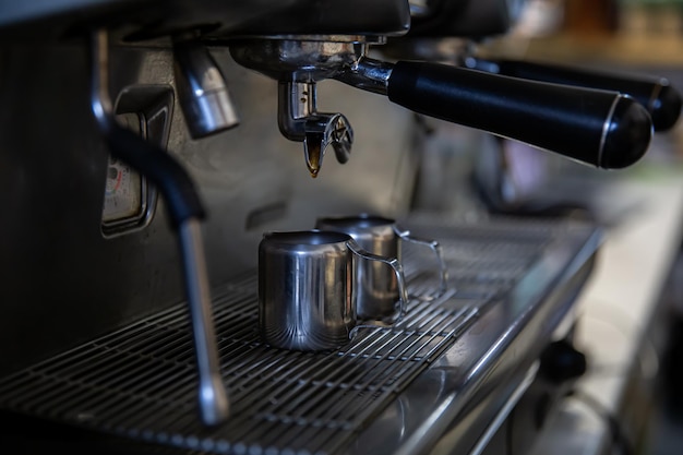 Close up of the process of making espresso in a professional coffee machine