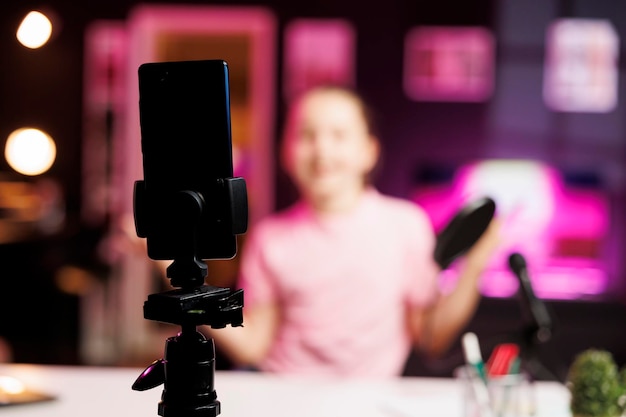 Free Photo close up of professional recording smartphone camera used by gen z internet star to do livestream