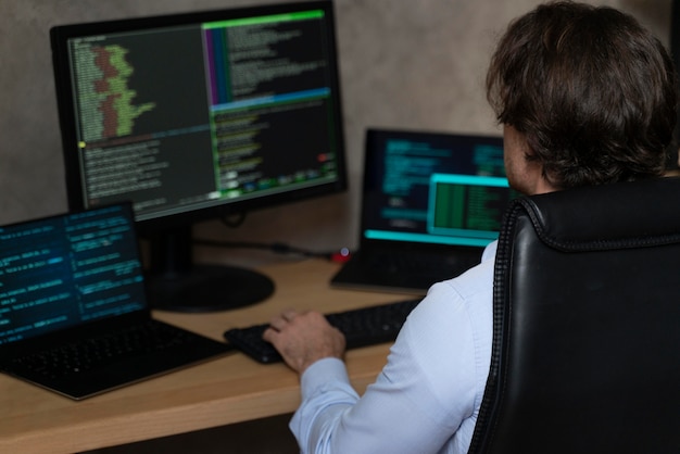 Close up programmer typing on keyboard