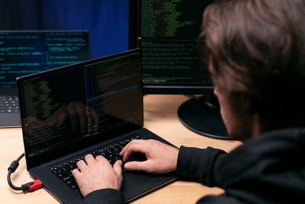 Close up programmer typing a keyboard