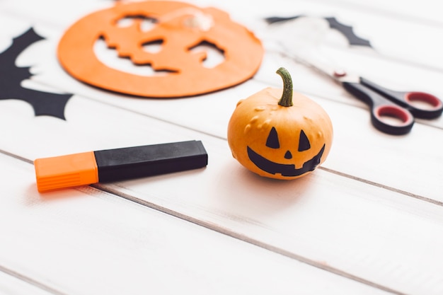 Free Photo close-up of pumpkin with painted face