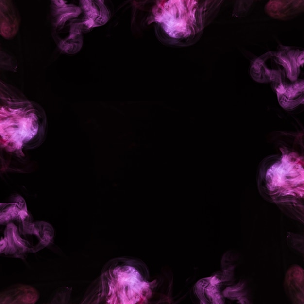 Free photo close-up of purple steam smoke design in circle on black background