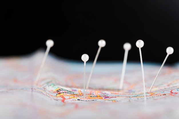 Free Photo close-up of pushpins showing destination points on map