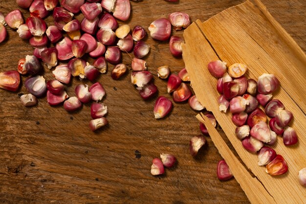 Close-up red corn kernels on table