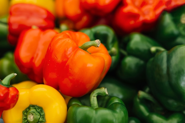 Free photo close-up of red; yellow and green bell peppers