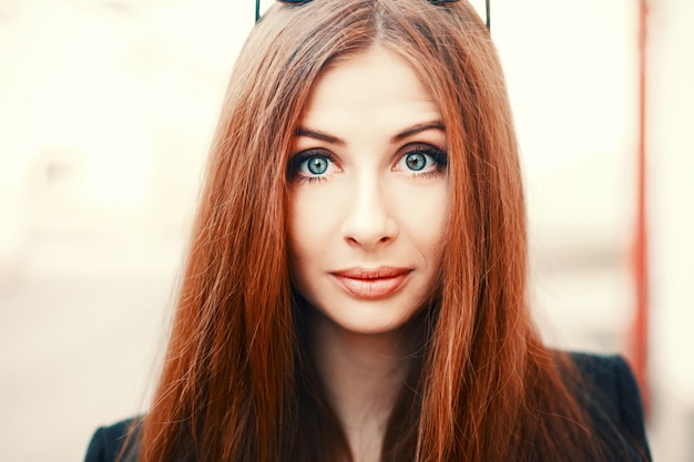 Free Photo close-up of redheaded woman with big eyes