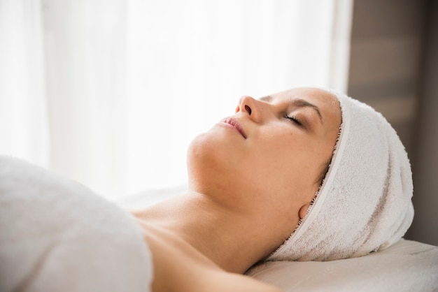 Close-up of a relaxed young woman at spa