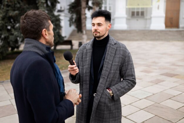 Close up on reporter taking an interview