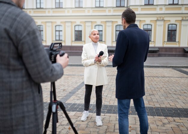 Close up on reporter taking an interview