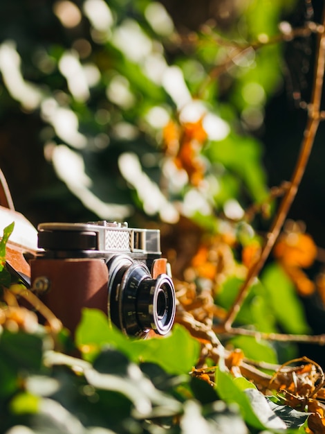 Close-up of a retro photo camera on ground