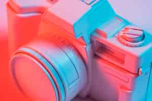 Free photo close-up of retro pink camera with blue light