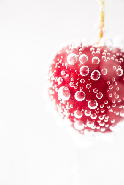 Free photo close-up ripe fresh red cherry with water