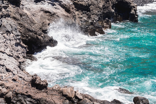 Close-up rocky coast with crystalline water