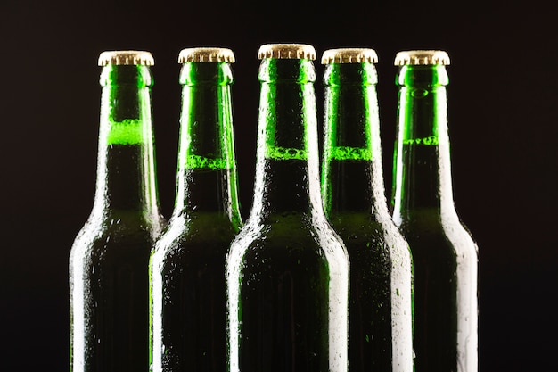 Free photo close-up row of beer bottles