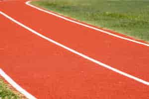 Free photo close up of a running track with white line to use for backgroun