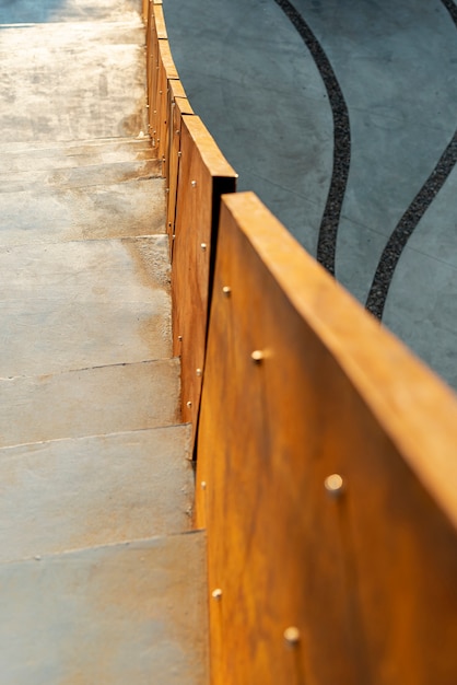 Close-up of rusted railing with white stairs