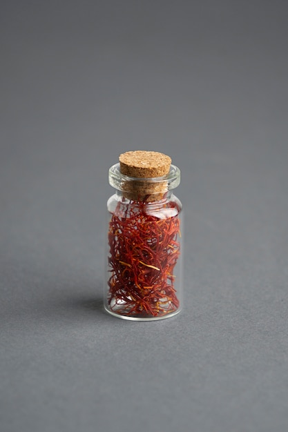 Close up on saffron in small bottle