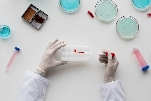 Close up  scientist holding pipette