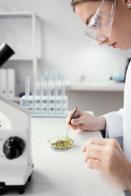 Close up scientist holding tweezers