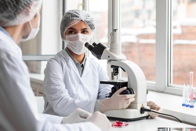 Close up scientist wearing masks