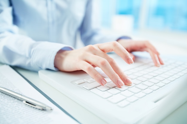 Close-up of secretary working in her office