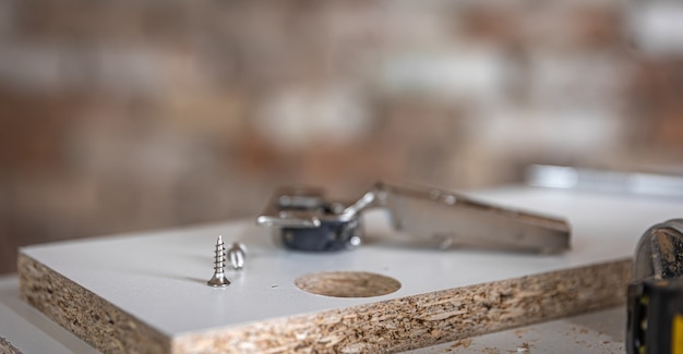 Free Photo close-up of a self-tapping screw, wood screw in the carpenter's craft.