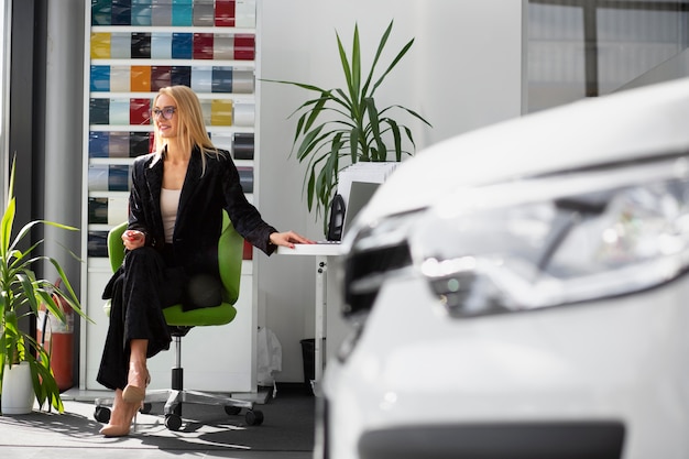 Close up on seller in car dealership