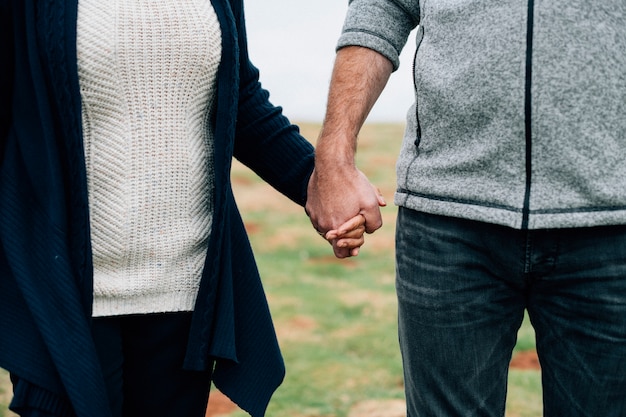 Free Photo close up of senior couple holding hands