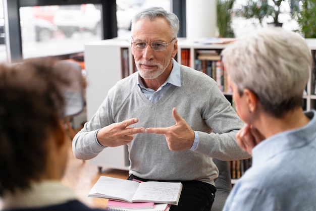 Free photo close up senior man sign language