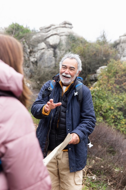 Close up senior people hiking together