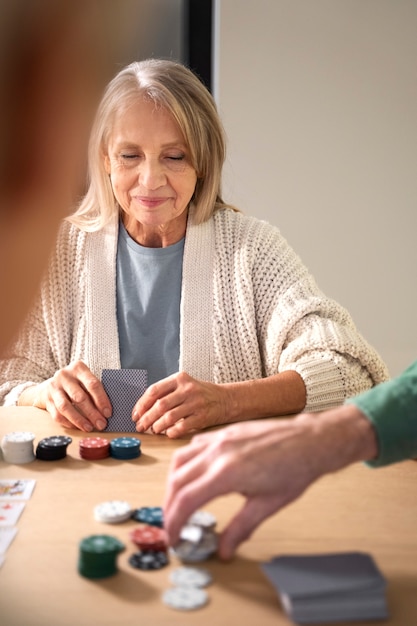 Free photo close up senior people playing game