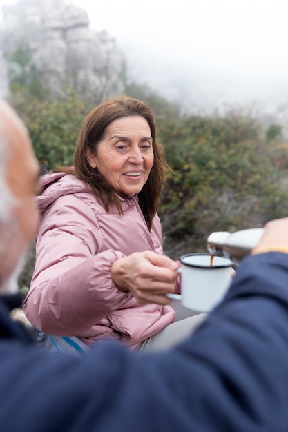 Close up senior people with coffee