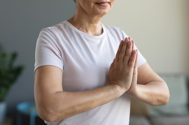 Close-up senior woman practicing meditation