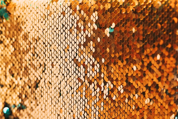 Free photo close-up of shiny golden sequin material