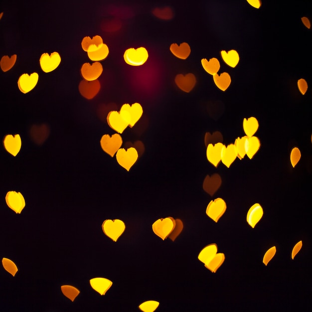 Free Photo close-up shiny yellow hearts