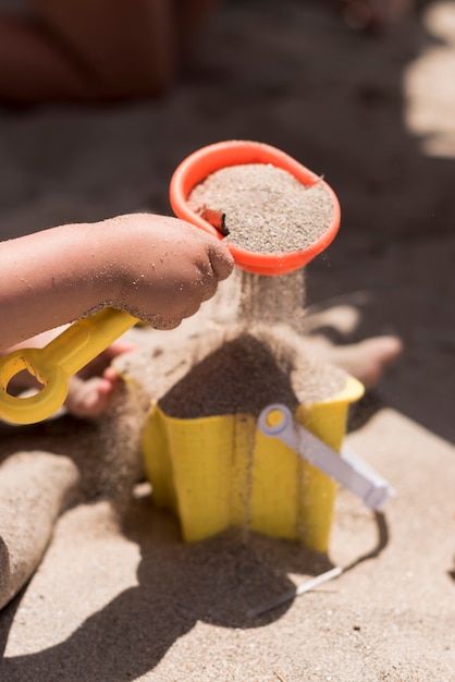 Free photo close up shot of bucket full of sand