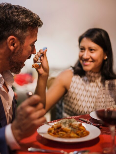 Close-up shot cheerful senior couple eating