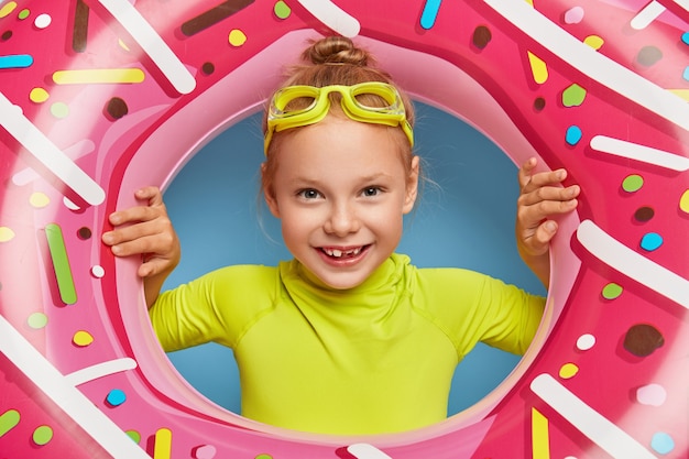 Free photo close up shot of cute redhead girl posing in her pool outfit