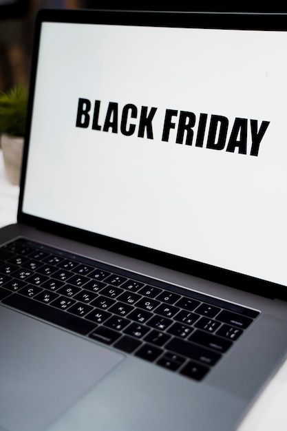 Close-up shot of a laptop with black friday desktop