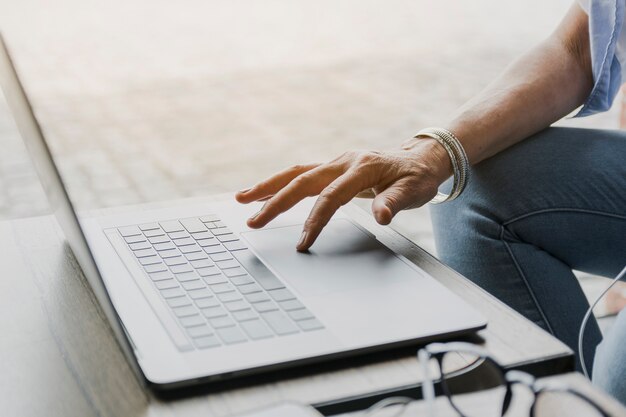 Close-up shot of person using laptop