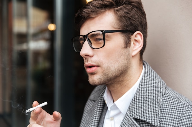 Close up side view of Serious businessman in eyeglasses