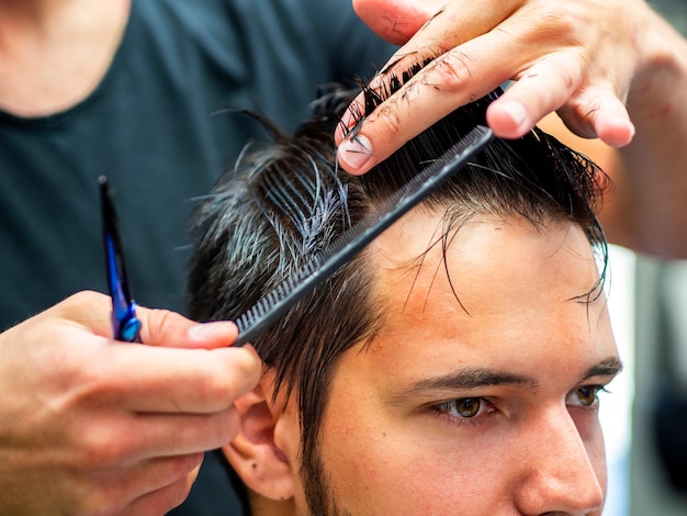 Close-up of sideways customer getting a cut