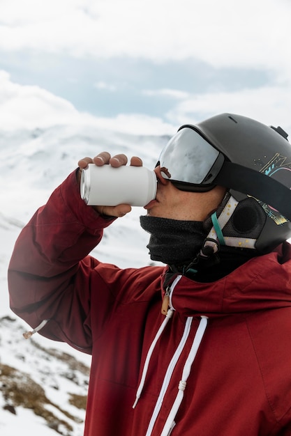 Close up skier drinking soda outdoors