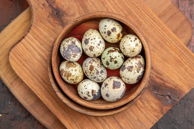 Close up on small eggs in a wooden pot